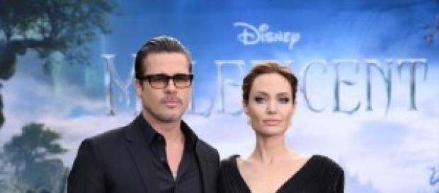 Pitt e Jolie alla presentazione di Maleficent. Pitt e Jolie alla presentazione di Maleficent.