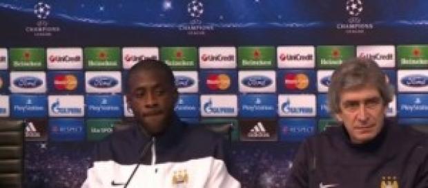 Manuel Pellegrini, City's manager and Yaya Touré Manuel Pellegrini, City's manager and Yaya Touré