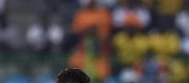 Moting takes on Guinea's defender Constant Moting takes on Guinea's defender Constant