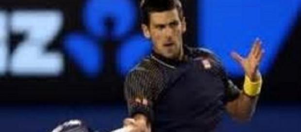 Djokovic comfortably through against Raonic Djokovic comfortably through against Raonic
