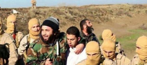 Jordanian Pilot, M. al-Kaseasbeh, being captured Jordanian Pilot, M. al-Kaseasbeh, being captured