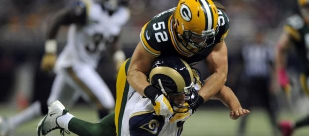 Rams QB Nick Foles gets to know Clay Matthews. Rams QB Nick Foles gets to know Clay Matthews.