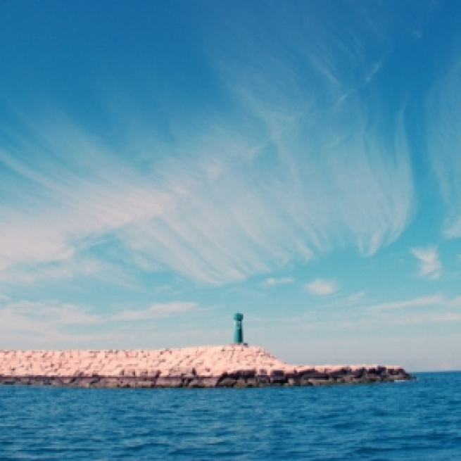 The lighthouse at Pharos attracts refugees