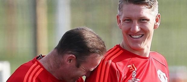 Schweinsteiger with Rooney who is also injured Schweinsteiger with Rooney who is also injured