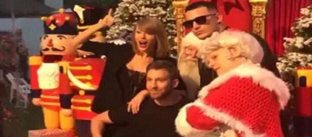 Taylor Swift and Calvin Harris at Christmas party. Taylor Swift and Calvin Harris at Christmas party.