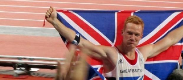 Rutherford winning the Olympic long jump title Rutherford winning the Olympic long jump title