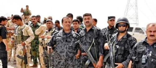 Peshmerga fighters wearing uniforms