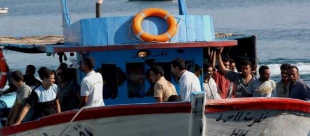 Boat carrying migrants off the coast of Lampedusa Boat carrying migrants off the coast of Lampedusa