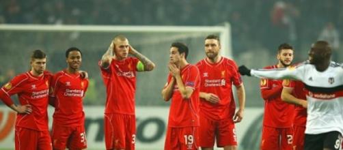 Liverpool players soak in the shock
