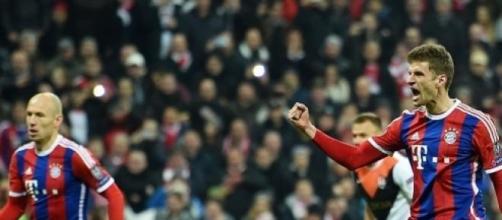 Thomas Muller celebrates scoring Bayern's opener 