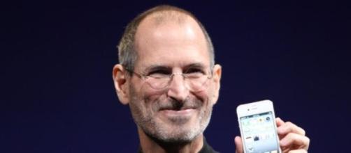 Steve Jobs in 2010 with the iPhone 4S.