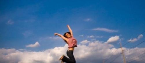 Woman jumping for happiness 