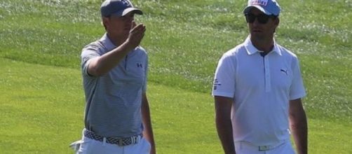 Spieth (left) held his nerve to clinch Masters