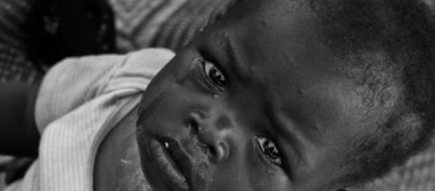 Kleines Kind in Mali. Bekanntes Motiv - Stereotyp. Kleines Kind in Mali. Bekanntes Motiv - Stereotyp.