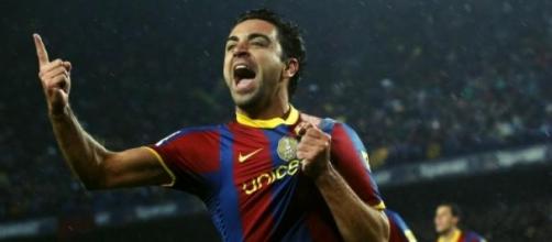 Xavi, celebrando un gol con el Barcelona