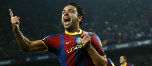 Xavi, celebrando un gol con el Barcelona