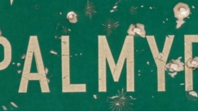 Un cartello della città siriana Palmira