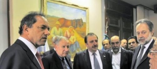 Daniel Scioli (izquierda) reunido con empresarios