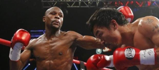 Mayweather y Pacquiao durante el combate. Mayweather y Pacquiao durante el combate.