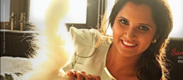 Sania Mirza poses with her cat for PETA ad Sania Mirza poses with her cat for PETA ad