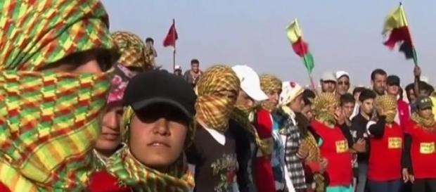 Kurdish supporters at a funeral in Syria Kurdish supporters at a funeral in Syria