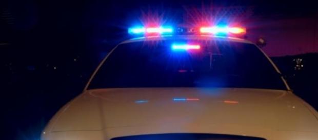 Maşină de poliţie la locul crimei Maşină de poliţie la locul crimei