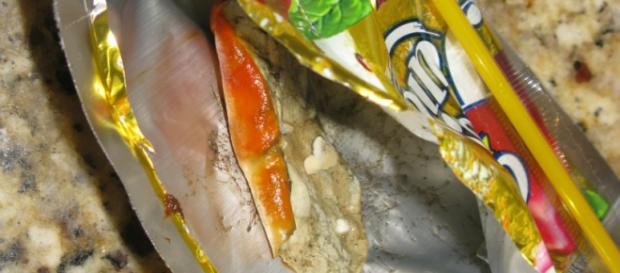 A packet of juice drink with unknown thing inside A packet of juice drink with unknown thing inside