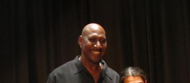 Darryl Dawkins standing with a fan Darryl Dawkins standing with a fan