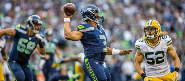 Clay Matthews (52) looks to stop Russell Wilson. Clay Matthews (52) looks to stop Russell Wilson.