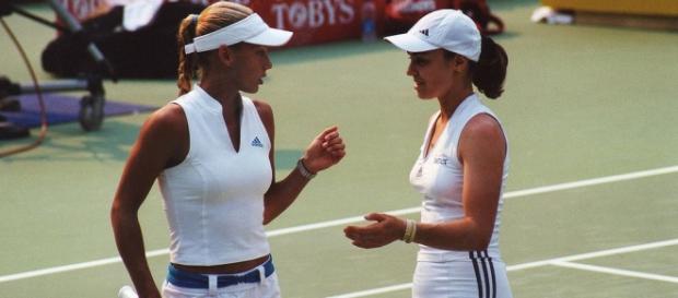 Doubles partners Kournikova (L) and Hingis (R). Doubles partners Kournikova (L) and Hingis (R).