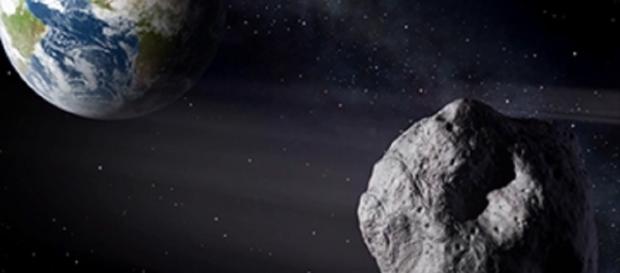 Earth approaching asteroid courtesy of NASA Earth approaching asteroid courtesy of NASA