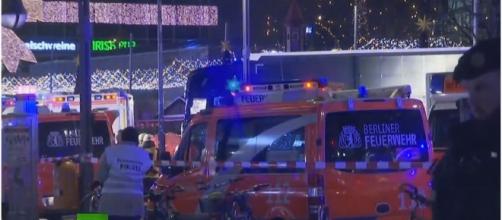 Truck plows into Christmas market in Berlin in likely terrorist attack - aftermath photo screencap from RT via Youtube