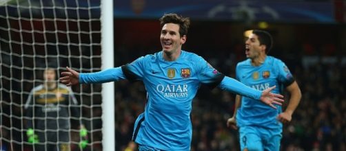 Lionel Messi celebrates scoring his second goal