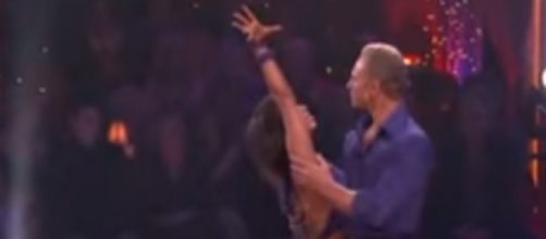 Cheryl Burke with Ian Ziering on the dance floor. YouTube