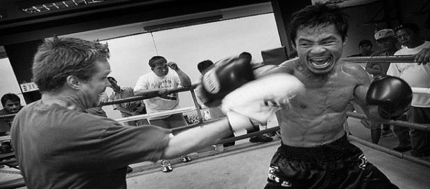 Pacquiao with longtime trainer Freddie Roach. / Roger Alcantara Pacquiao with longtime trainer Freddie Roach. / Roger Alcantara