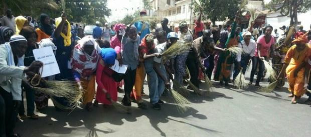 Protesters with brooms showing signs they want to sweep Jammeh out of The Gambia / UDP Photo, Suntou Touray Protesters with brooms showing signs they want to sweep Jammeh out of The Gambia / UDP Photo, Suntou Touray