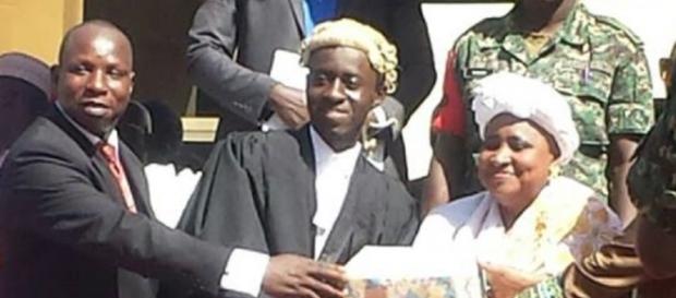 Jabang is seen in this photo receiving an academic excellence award from VP Njie-Saidy / Photo via Sainey Marenah Jabang is seen in this photo receiving an academic excellence award from VP Njie-Saidy / Photo via Sainey Marenah
