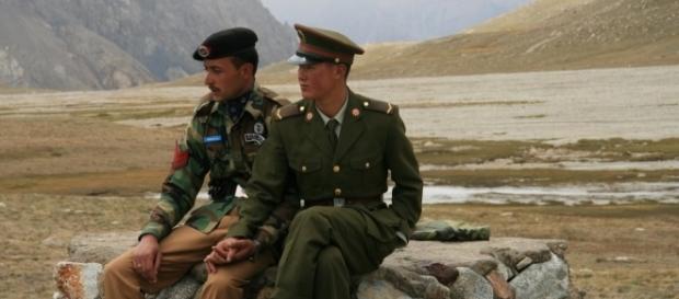 A Pakistani and Chinese border guard at Khunjerab Pass / Photo via Anthony Maw, Own work A Pakistani and Chinese border guard at Khunjerab Pass / Photo via Anthony Maw, Own work