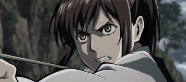 Shasha fending of a titan to save a child (Credit: Wit Studio) Shasha fending of a titan to save a child (Credit: Wit Studio)