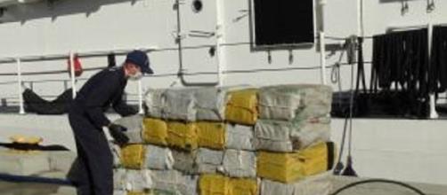 Coast Guard crews unload some of the 2,000 pounds of cocaine seized off the coast of the Dominican Republic. -- U.S. Coast Guard