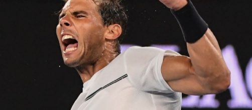 Rafael Nadal exulte après une victoire à l'Open d'Australie à Melbourne (AFP/SAEED KHAN)