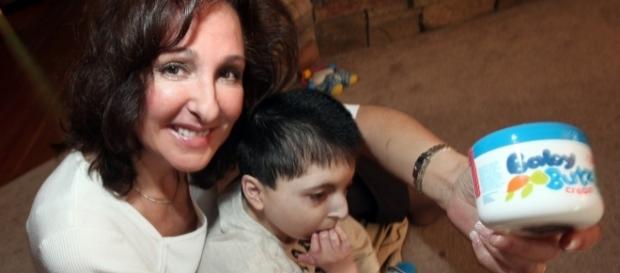 Majda Ficko and her son Demitri with the cream she invented for him. / Photos via Phil Hossack, the Winnipeg Free Press, and Olen Cosmetics. Majda Ficko and her son Demitri with the cream she invented for him. / Photos via Phil Hossack, the Winnipeg Free Press, and Olen Cosmetics.