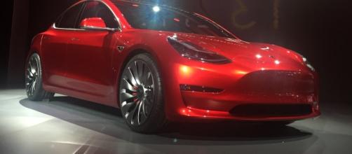 Red Tesla Model 3 at the March 31, 2016, unveiling event, Hawthorne, California by Steve Jurvetson/Wikimedia Commons