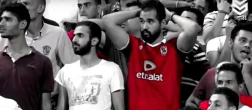 Egyptian football fans wait in suspense just before Mohamed Salah scores the winning goal. Photo via Foot Goal/YouTube.