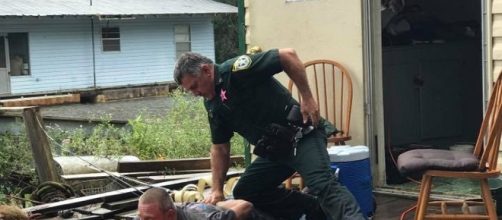 A Franklin County, Florida deputy arrests Kevin Wyatt on prostitution charges at a houseboat. Franklin County Sheriff's Office photo