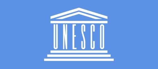 Flag of UNESCO [Image by By Mouagip (Based on the previous version of Madden)|Wikimedia Commons| Cropped | public domain ]