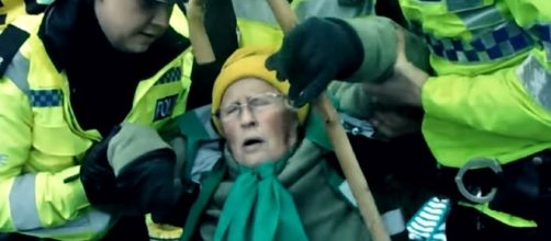 An elderly anti-fracking protester was treated brutally by police in the U.K. [Image credit: RT/YouTube]