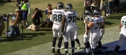 Seahawks' offense celebrating after a touchdown (Image Credit via NFL/YouTube)