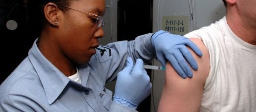 A US Navy sailor receives a Hepatitis A vaccine from a medic.[image credit;Christopher Blachly/wikimedia]