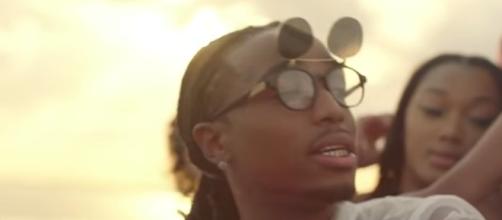 The rap trio has seen their popularity continue to rise throughout the year. [Image via Migos ATL/YouTube screencap]